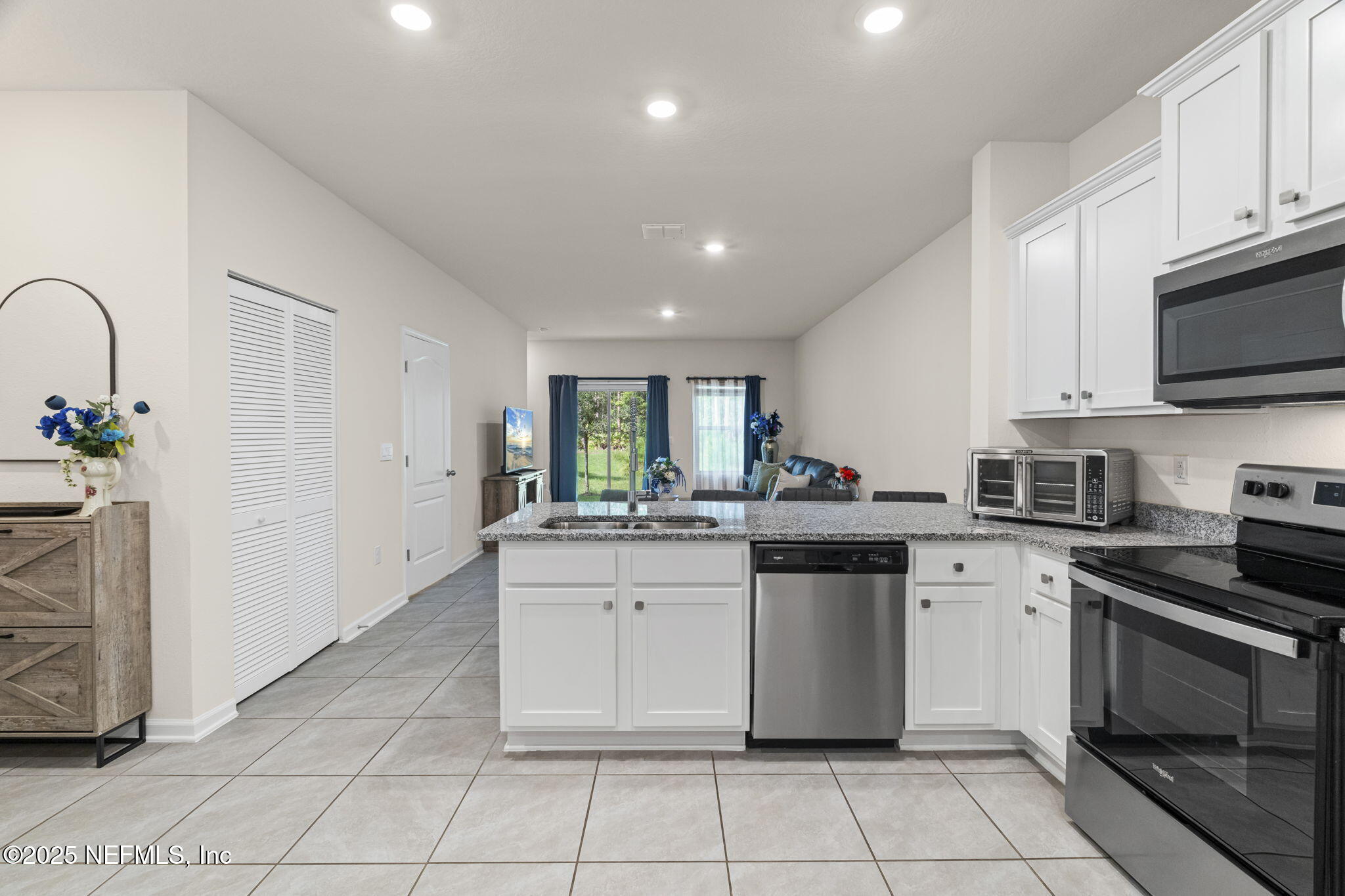 263 Talulla Trail St. Augustine, FL 32095 - Photo 7 of 32 a kitchen with a sink stove and cabinets