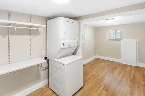 a view of a hallway to a livingroom with a couch