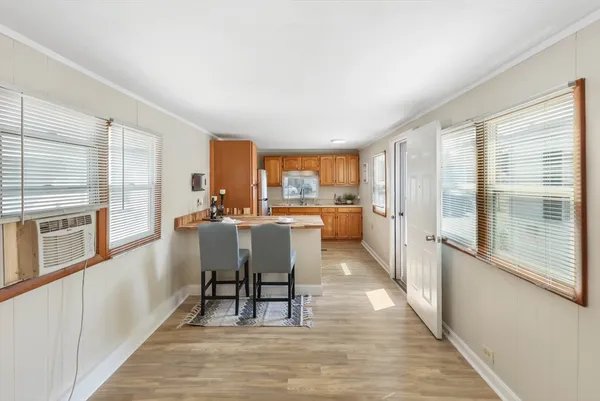 a kitchen with stainless steel appliances granite countertop a sink and a refrigerator