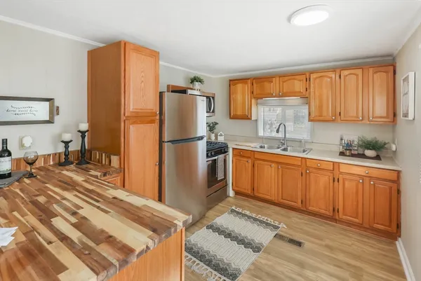 a white refrigerator freezer sitting inside of a kitchen