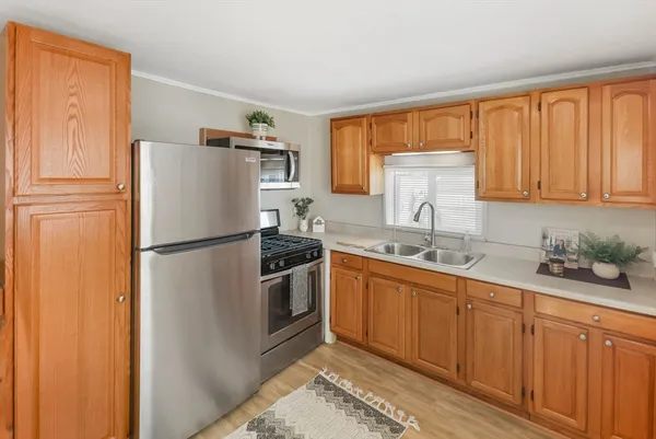 a view of a kitchen from the hallway