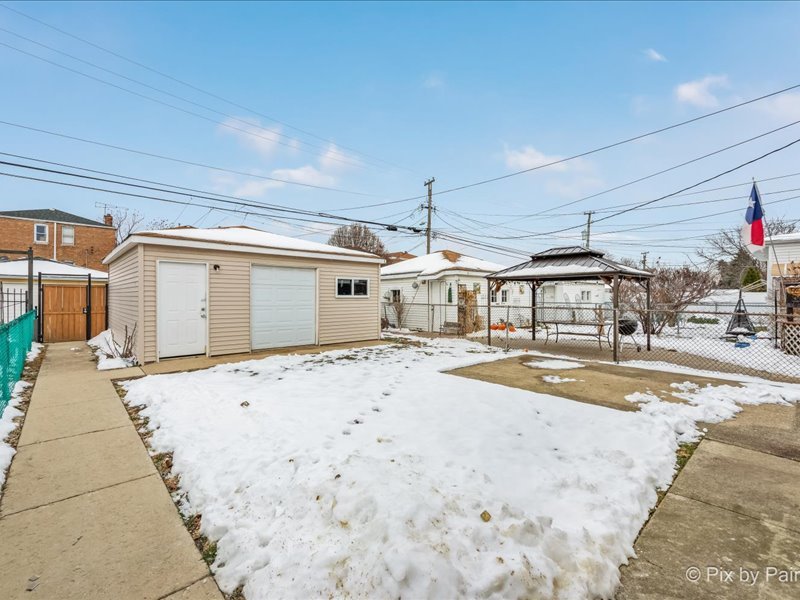 3922 West 59th Place Chicago, IL 60629 - Photo 26 of 29 a front view of a house with a outdoor space