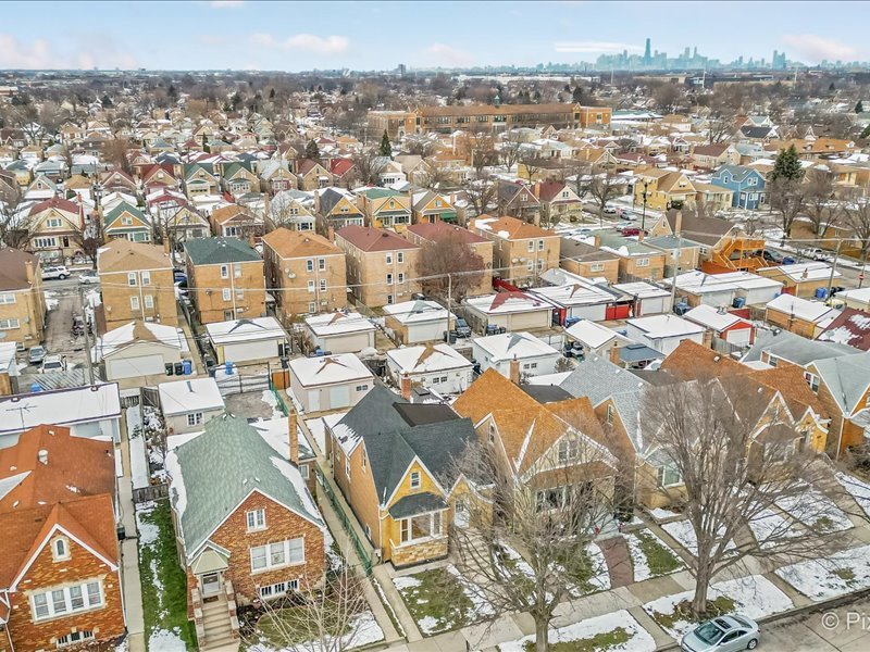 3922 West 59th Place Chicago, IL 60629 - Photo 3 of 29 an aerial view of a residential houses with city view