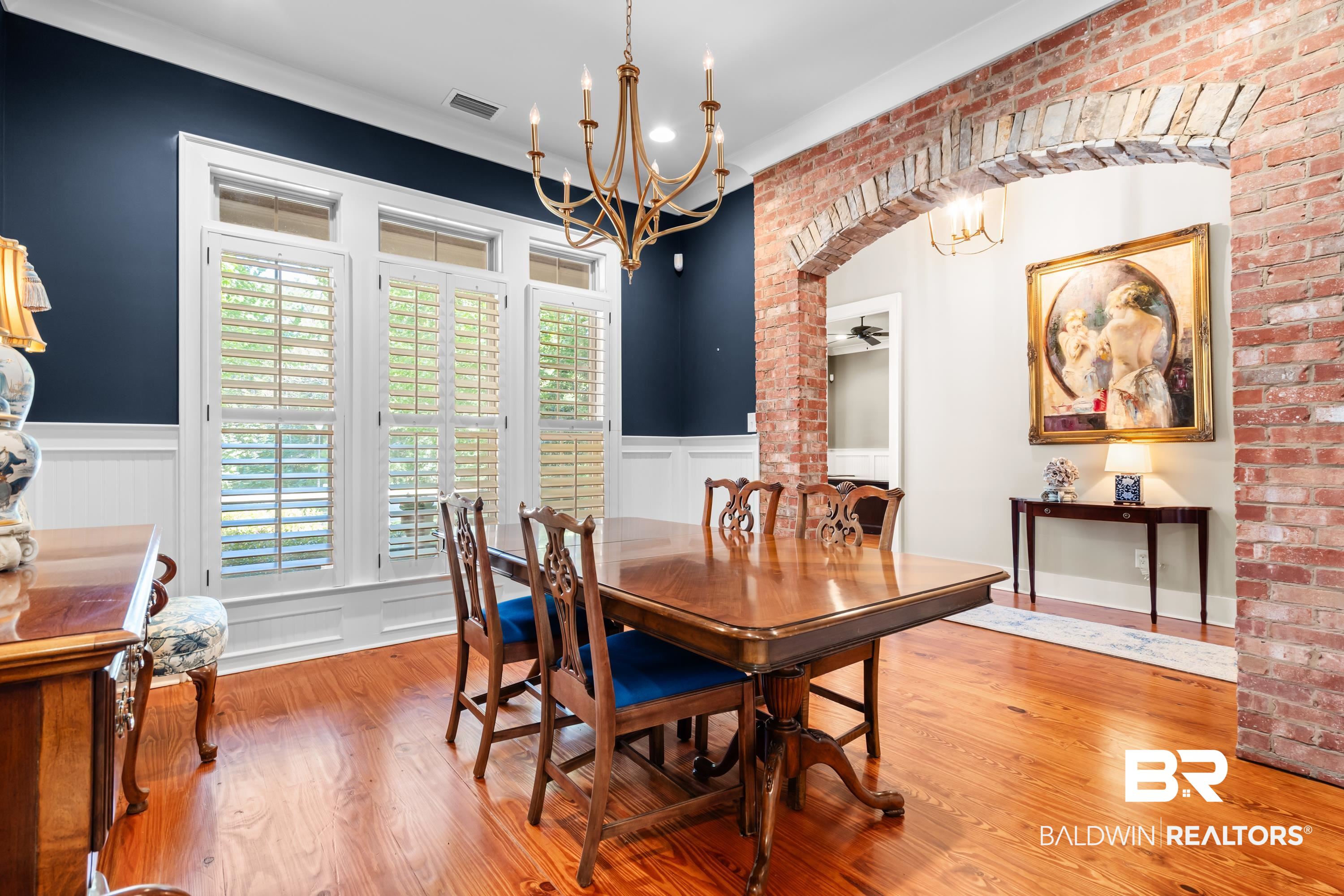 30057 Dolive Ridge Daphne, AL 36527 - Photo 6 of 55 Dining room with a wealth of natural light, ceiling fan, brick wall, and hardwood / wood-style flooring