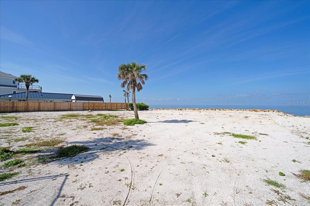 3761 Casey Key Road Nokomis, FL 34275 - Photo 13 of 23 a view of a backyard of a house