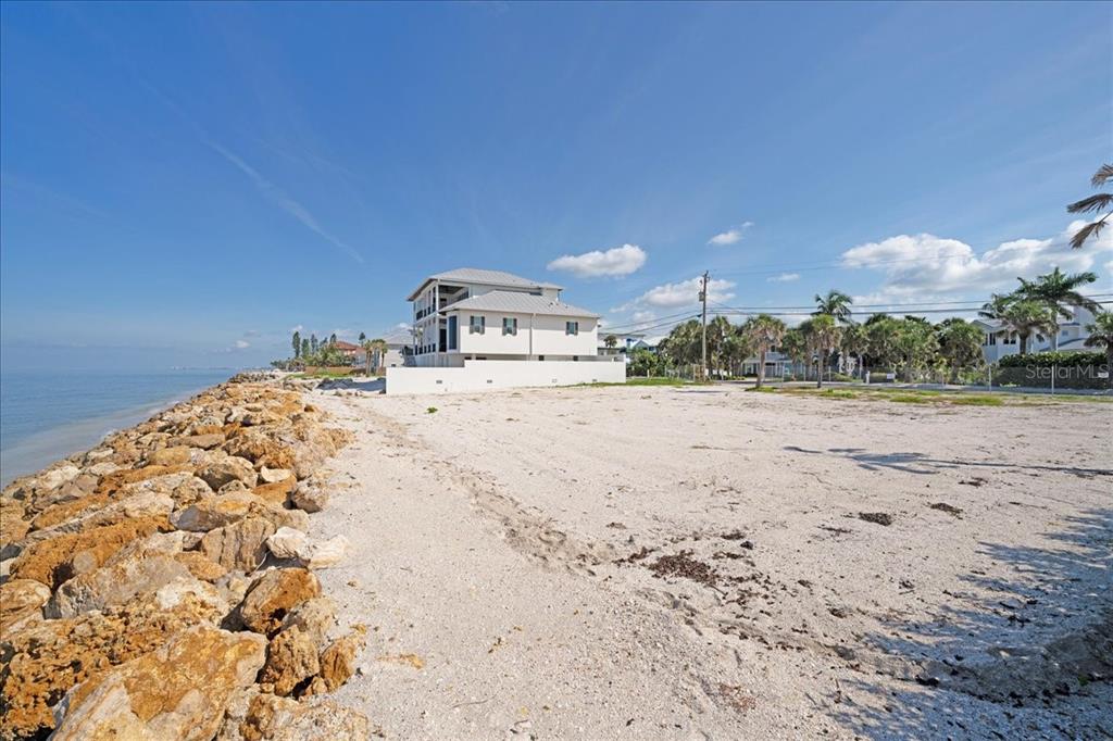 3761 Casey Key Road Nokomis, FL 34275 - Photo 15 of 23 a view of a dry yard with wooden fence
