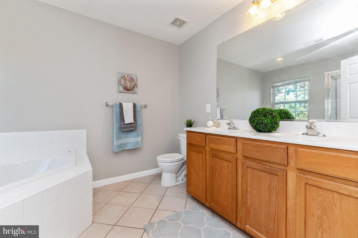 9817 Davison Road Baltimore, MD 21220 - Photo 19 of 43 Master suite bath with double vanities