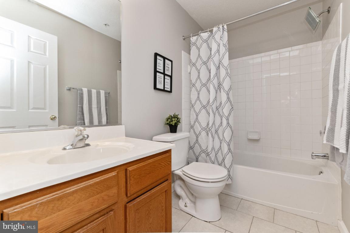 9817 Davison Road Baltimore, MD 21220 - Photo 23 of 43 Full bathroom with tub on upper level