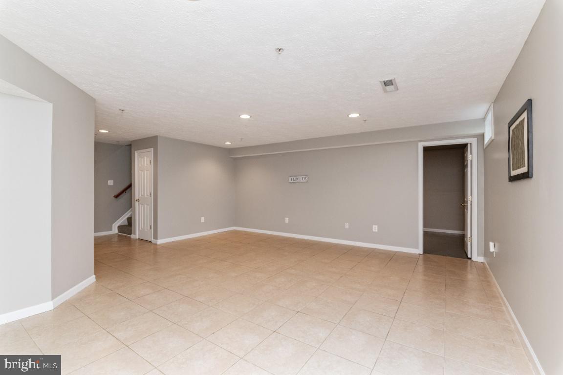 9817 Davison Road Baltimore, MD 21220 - Photo 30 of 43 Spacious rec room/media room