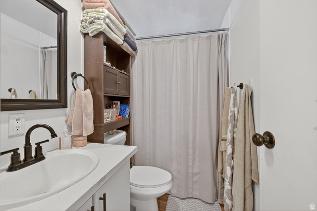 262 Hidden View Drive, Unit 94 Sandy, UT 84070 - Photo 15 of 18 Bathroom featuring vanity and curtained shower