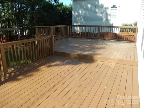 a view of balcony with wooden floor
