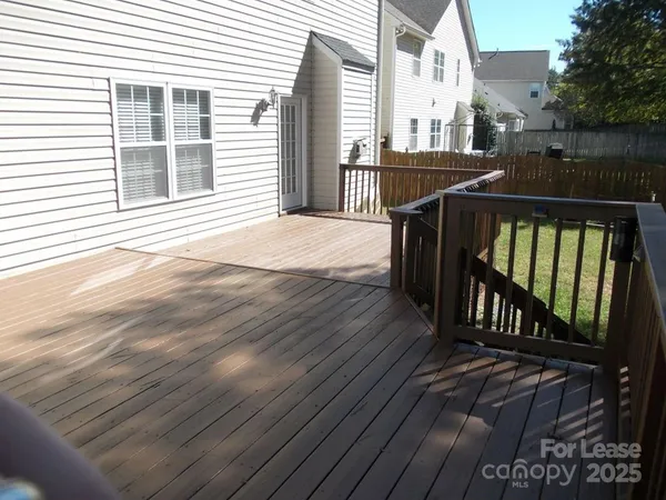 a view of a balcony with furniture