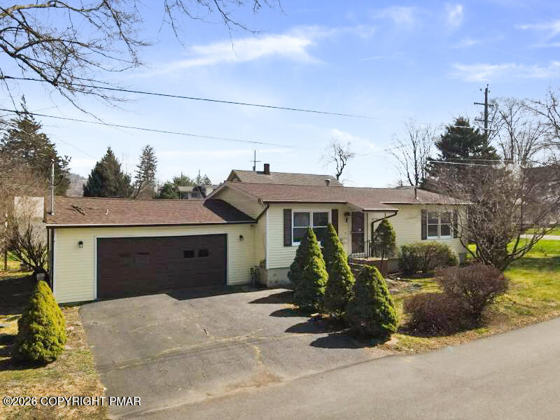 605 5th Street Matamoras, PA 18336 - Photo 1 of 27 a front view of a house with glass windows and furniture