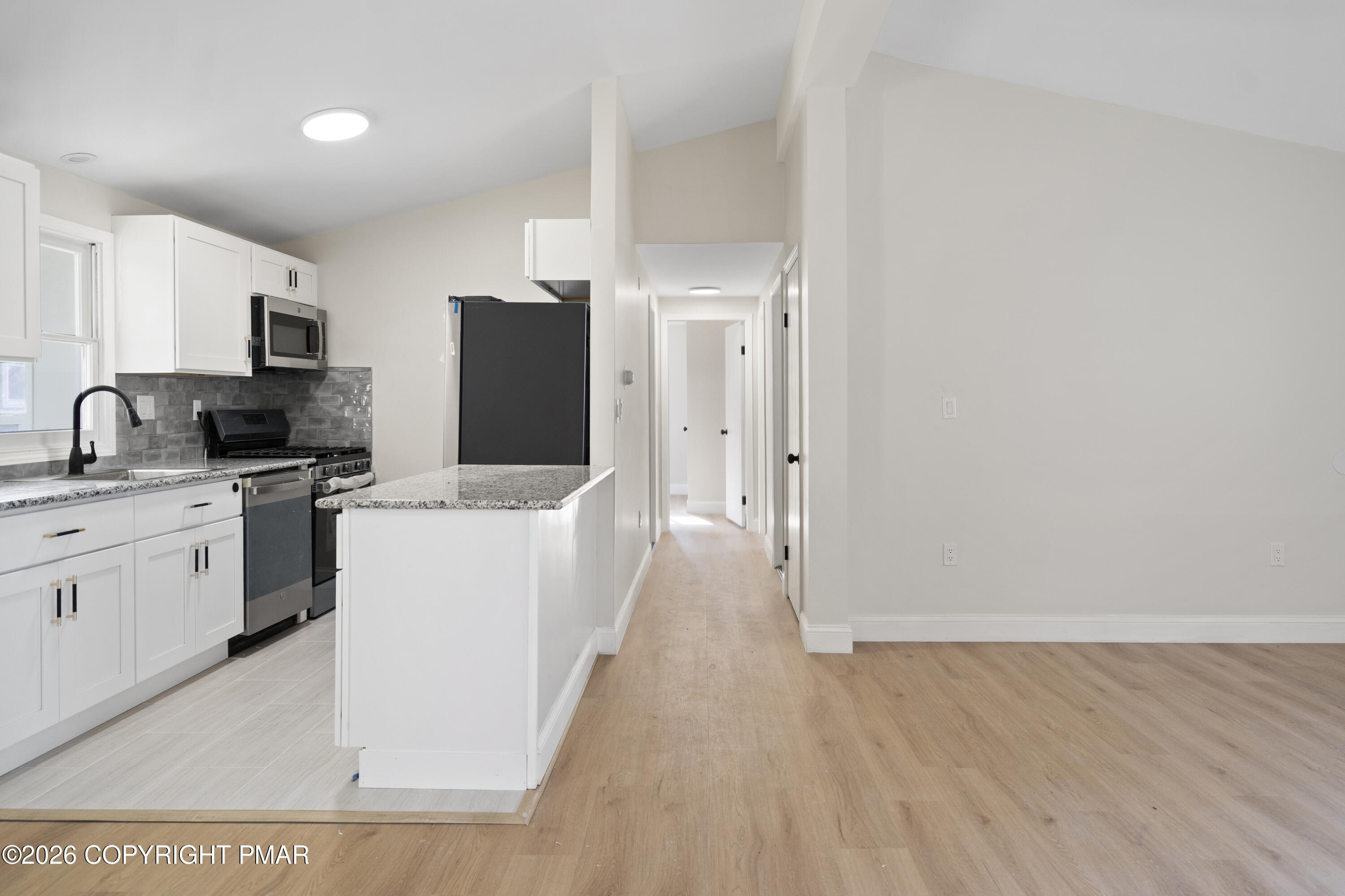 605 5th Street Matamoras, PA 18336 - Photo 11 of 27 a kitchen with sink a refrigerator and cabinets