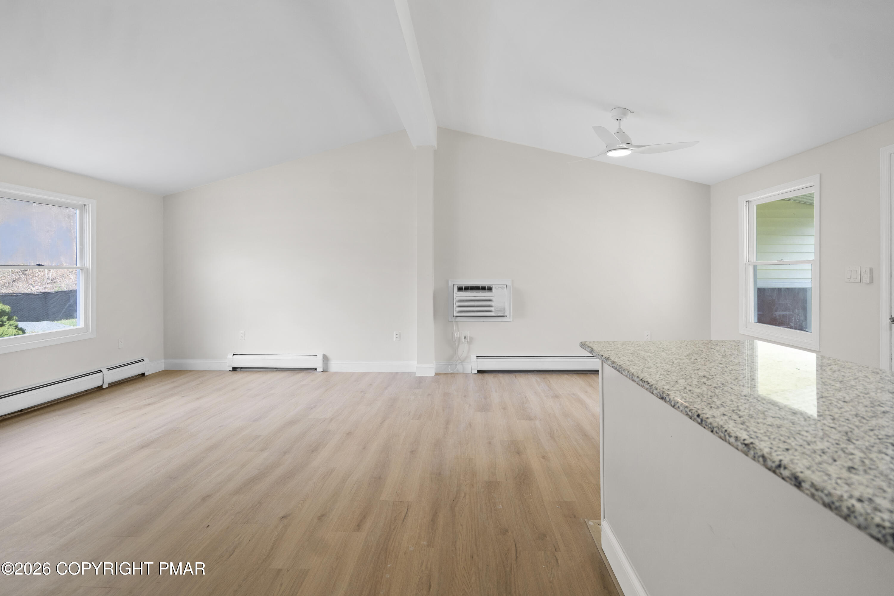 605 5th Street Matamoras, PA 18336 - Photo 13 of 27 an empty room with wooden floor and windows