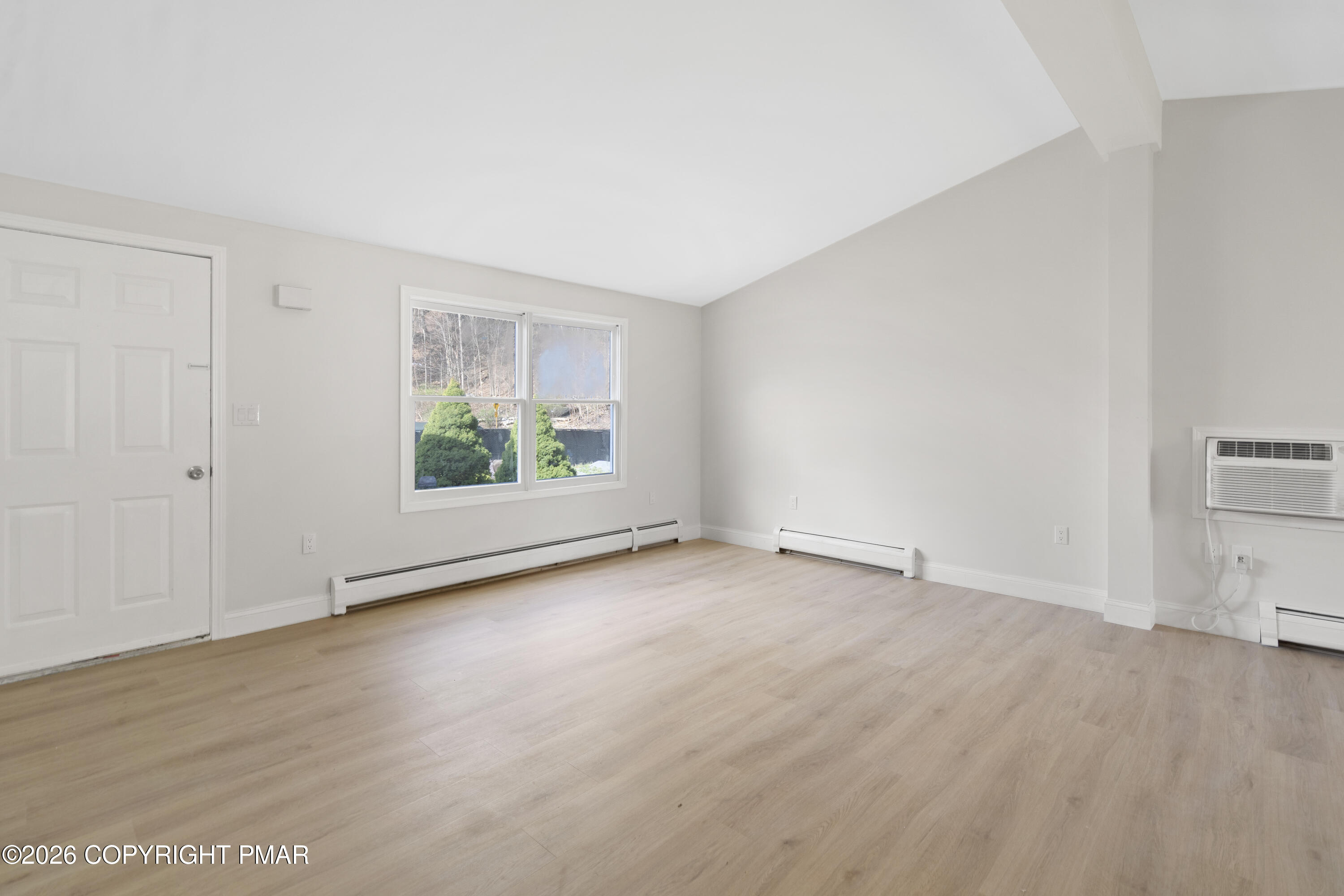 605 5th Street Matamoras, PA 18336 - Photo 14 of 27 an empty room with wooden floor and window