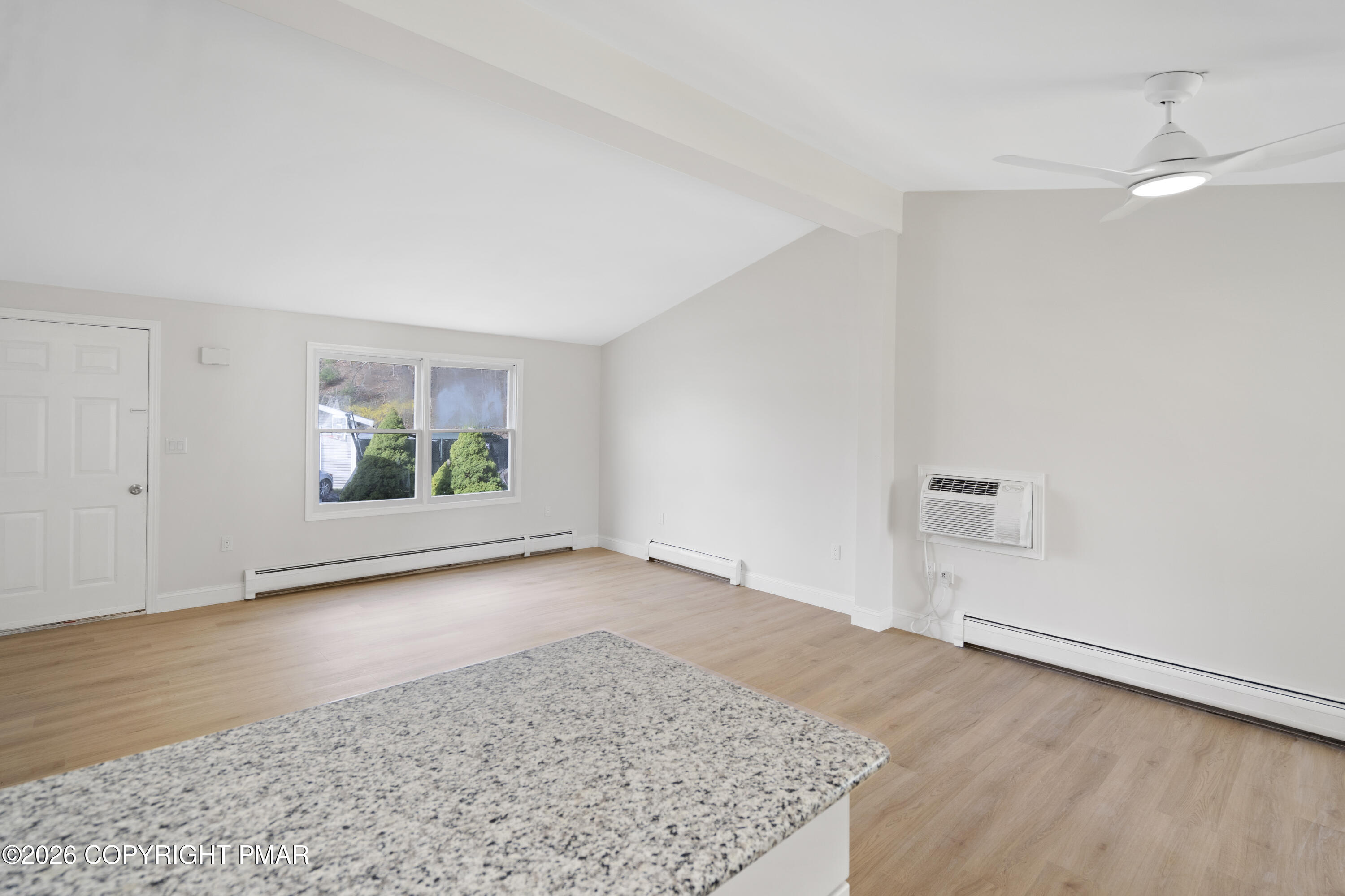 605 5th Street Matamoras, PA 18336 - Photo 15 of 27 an empty room with wooden floor and window