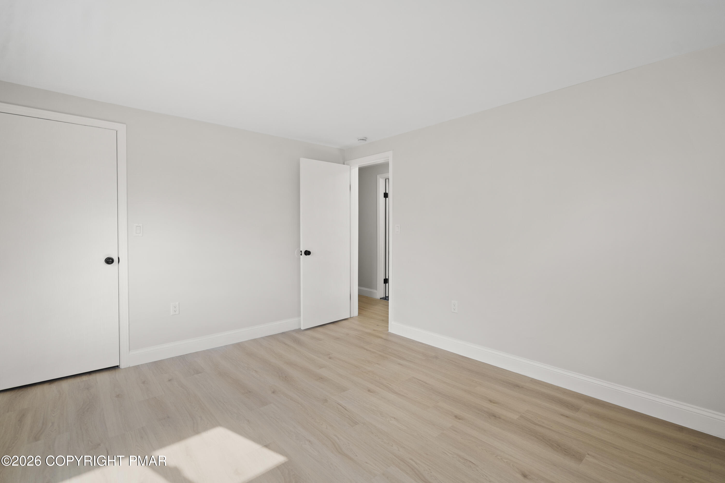 605 5th Street Matamoras, PA 18336 - Photo 17 of 27 a view of an empty room with wooden floor