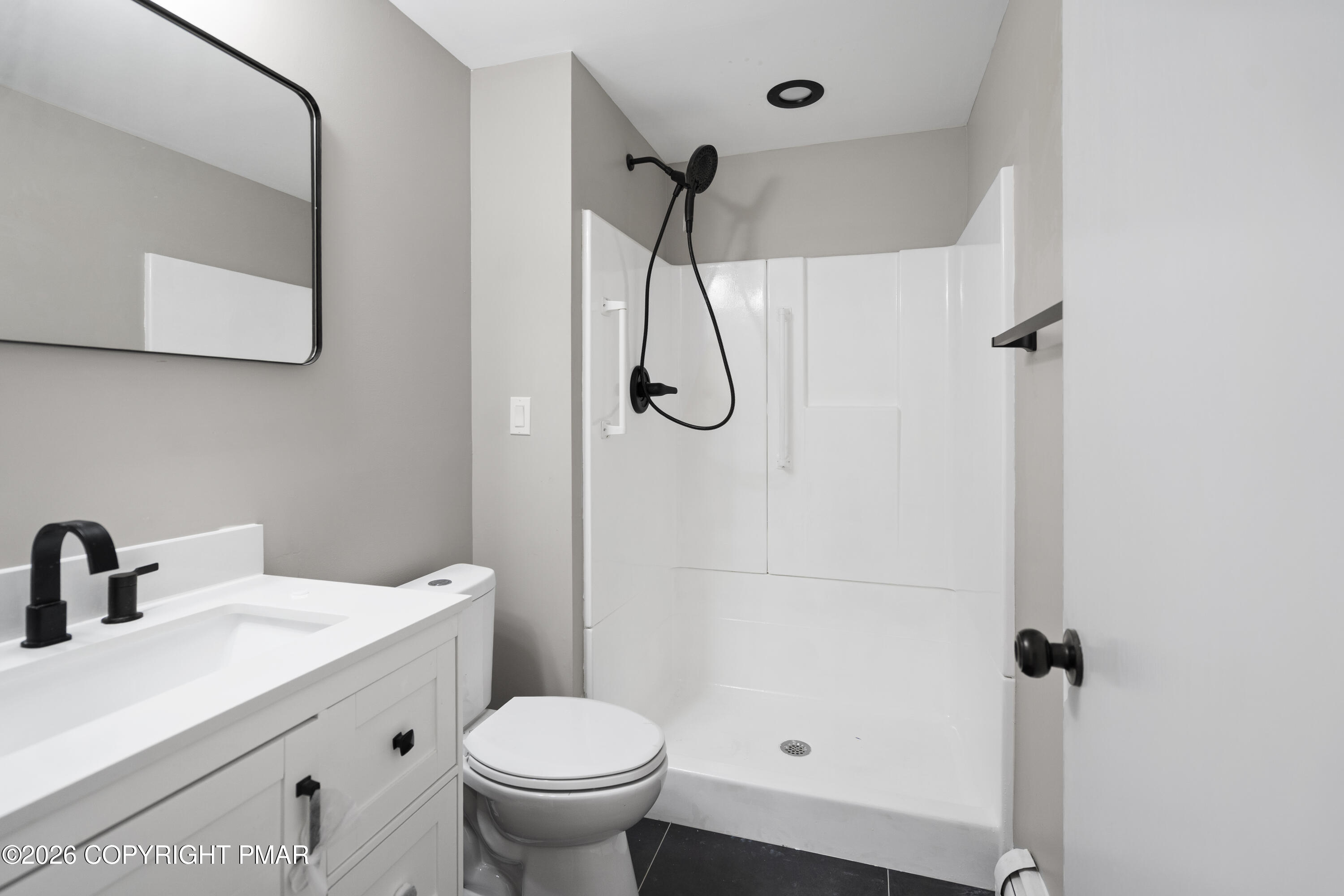 605 5th Street Matamoras, PA 18336 - Photo 21 of 27 a bathroom with a sink toilet and shower