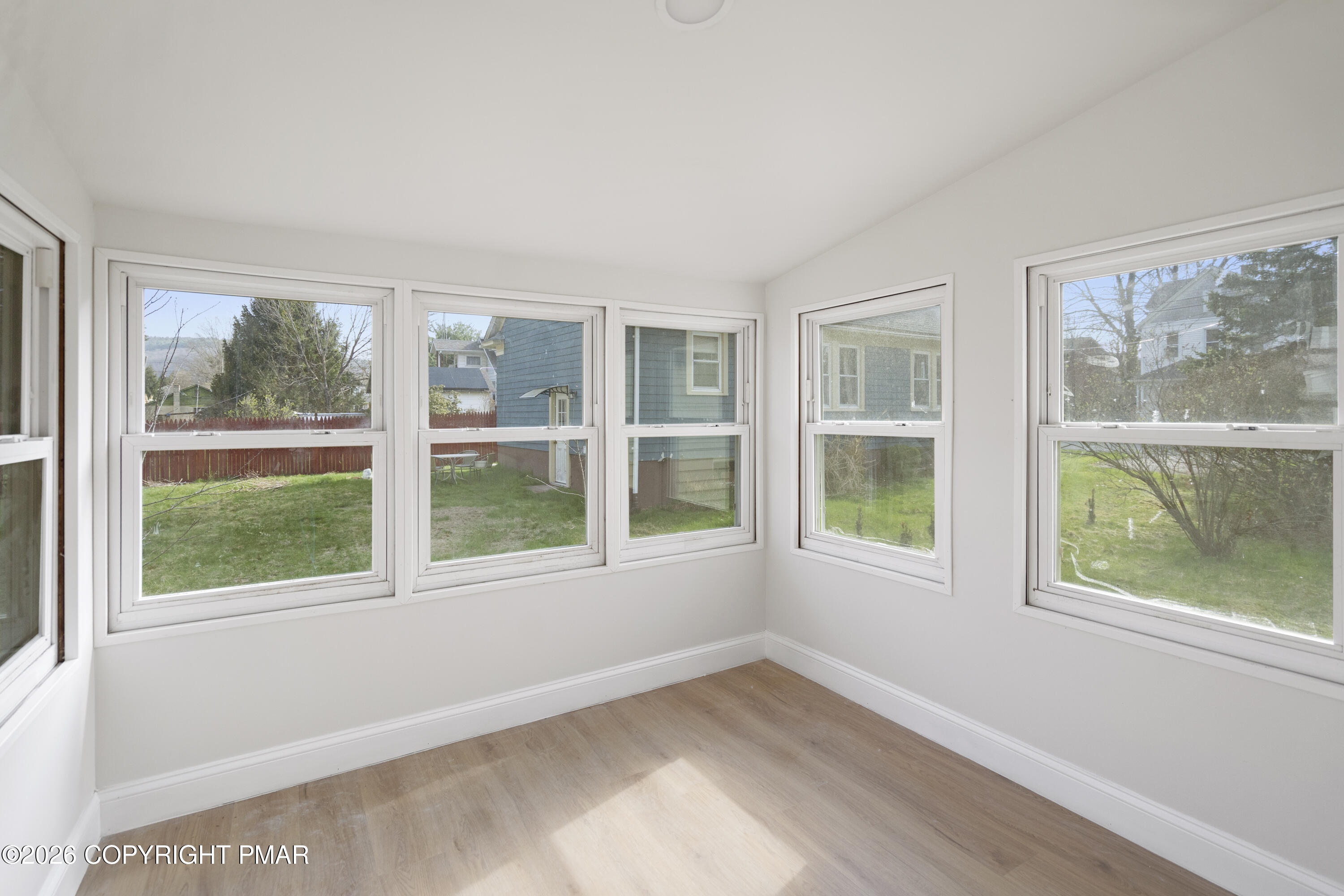 605 5th Street Matamoras, PA 18336 - Photo 22 of 27 a view of empty room with wooden floor and fan
