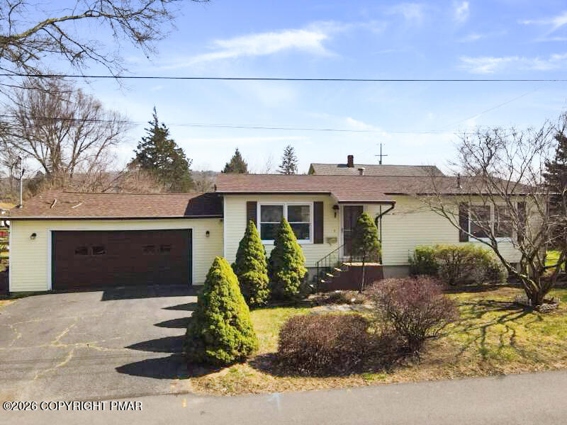 605 5th Street Matamoras, PA 18336 - Photo 3 of 27 a front view of a house with garden