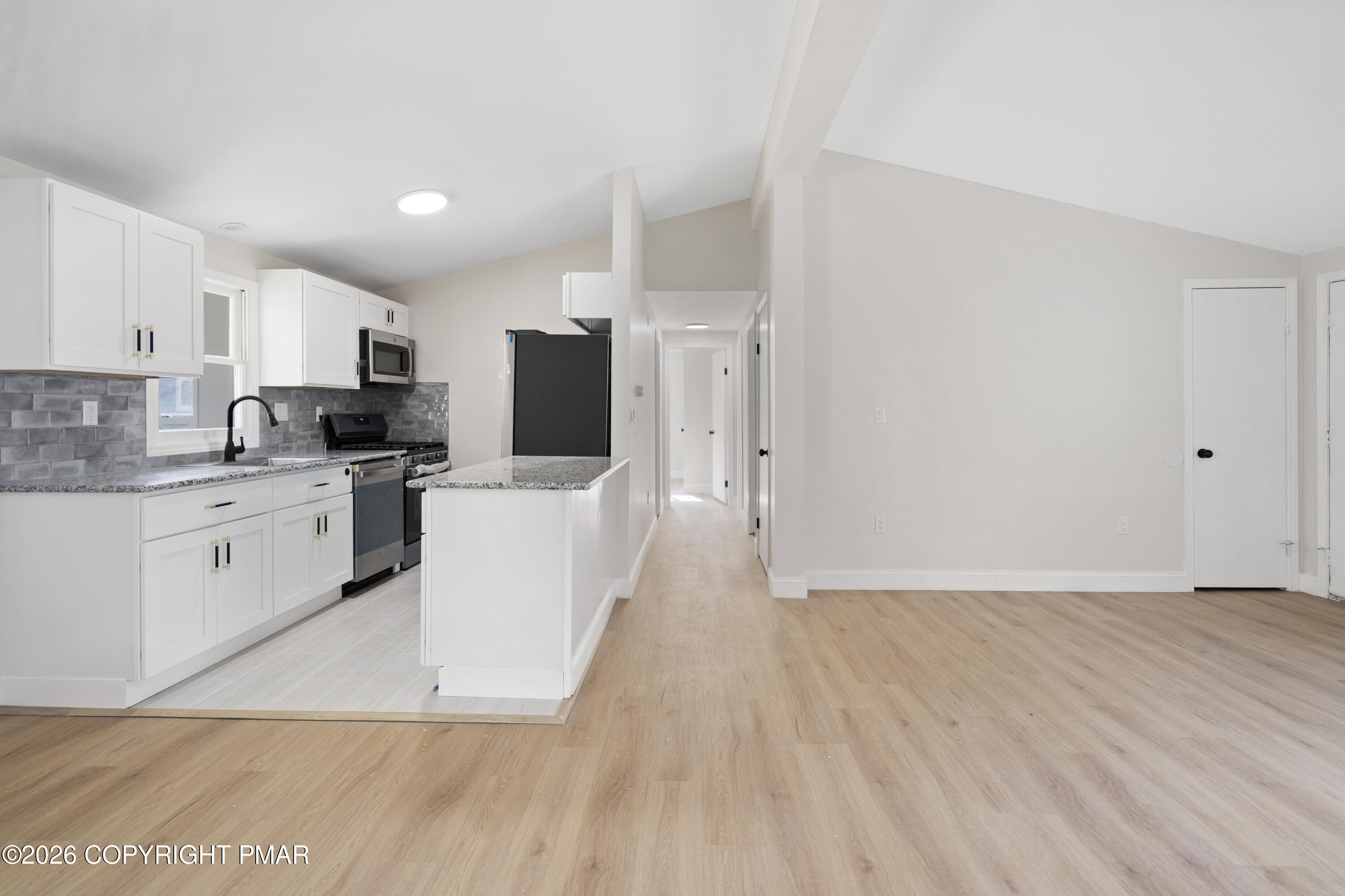 605 5th Street Matamoras, PA 18336 - Photo 10 of 27 a view of a kitchen with wooden floor and electronic appliances