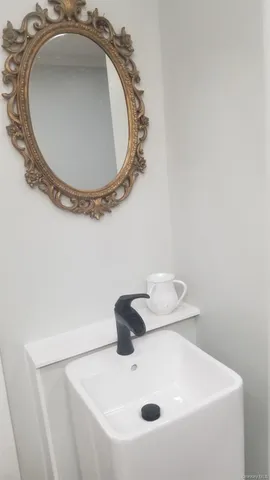 a bathroom with a sink and mirror