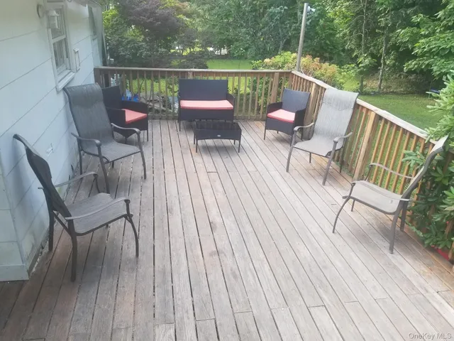 a view of a swimming pool with a patio and a garden