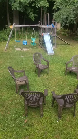 a view of a field with trees