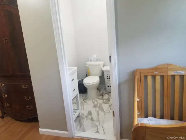 a bathroom with a toilet and a sink