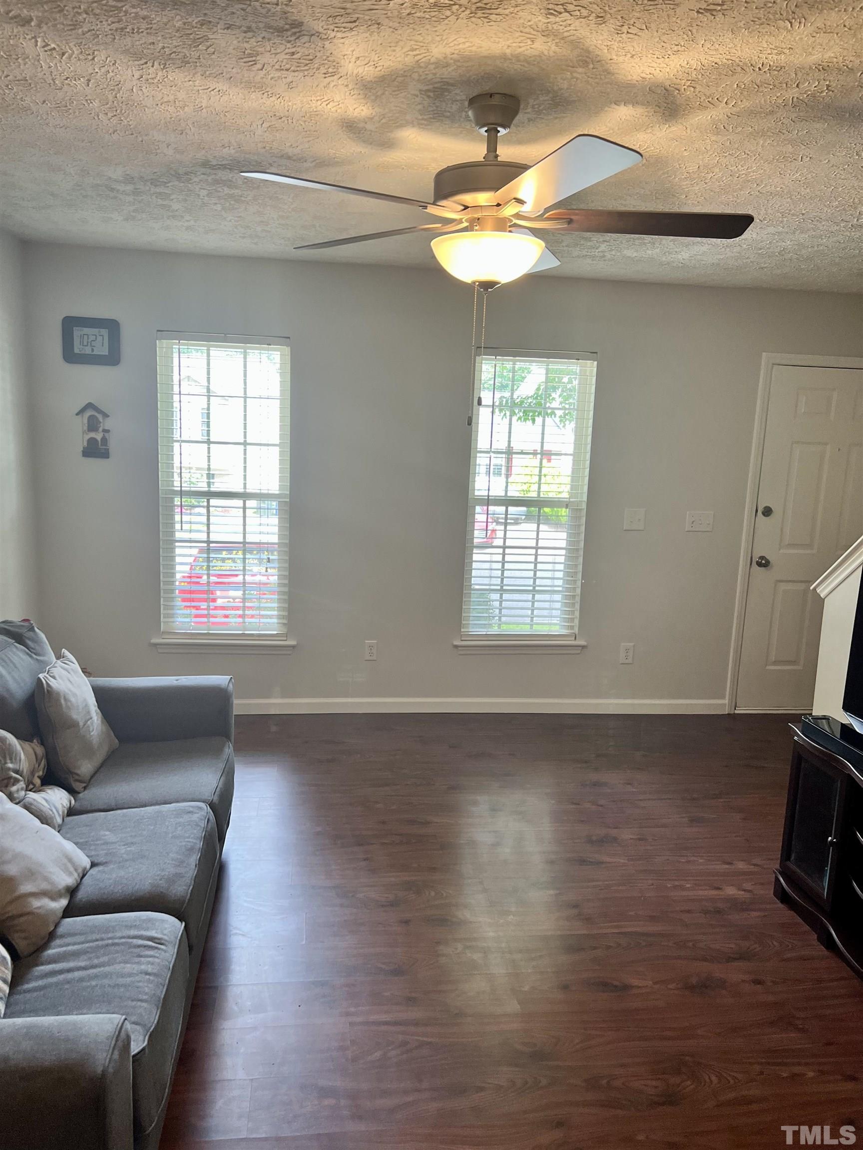 2216 Springhill Avenue Raleigh, NC 27603 - Photo 3 of 7 a living room with furniture and a window