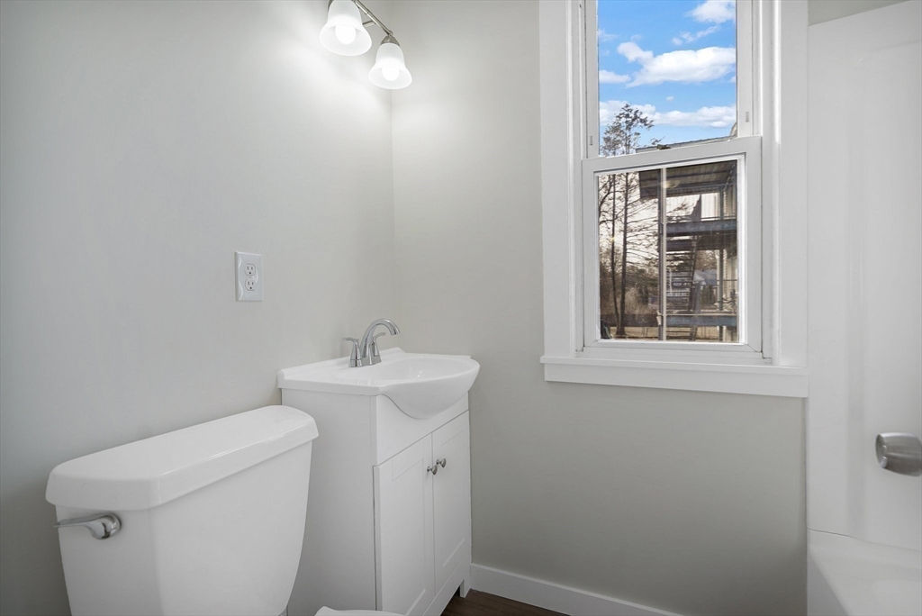 86-88 Chestnut Street Springfield, MA 01151 - Photo 11 of 40 a bathroom with a sink and a toilet