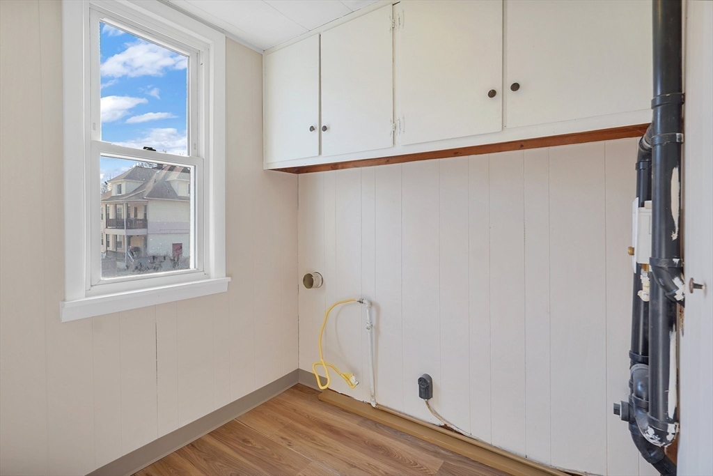 86-88 Chestnut Street Springfield, MA 01151 - Photo 15 of 40 a view of a closet area with wooden floor