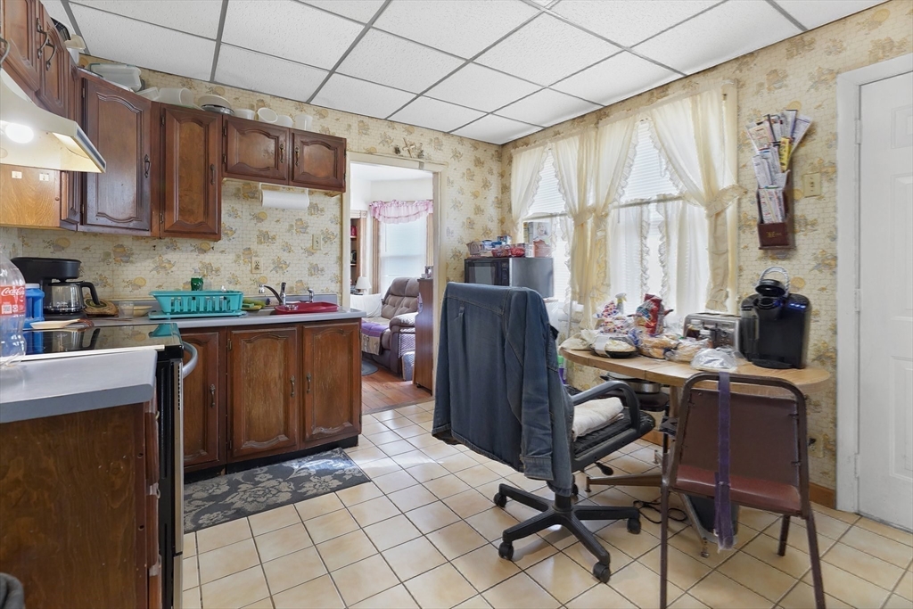 86-88 Chestnut Street Springfield, MA 01151 - Photo 23 of 40 a view of a kitchen with refrigerator and cabinets