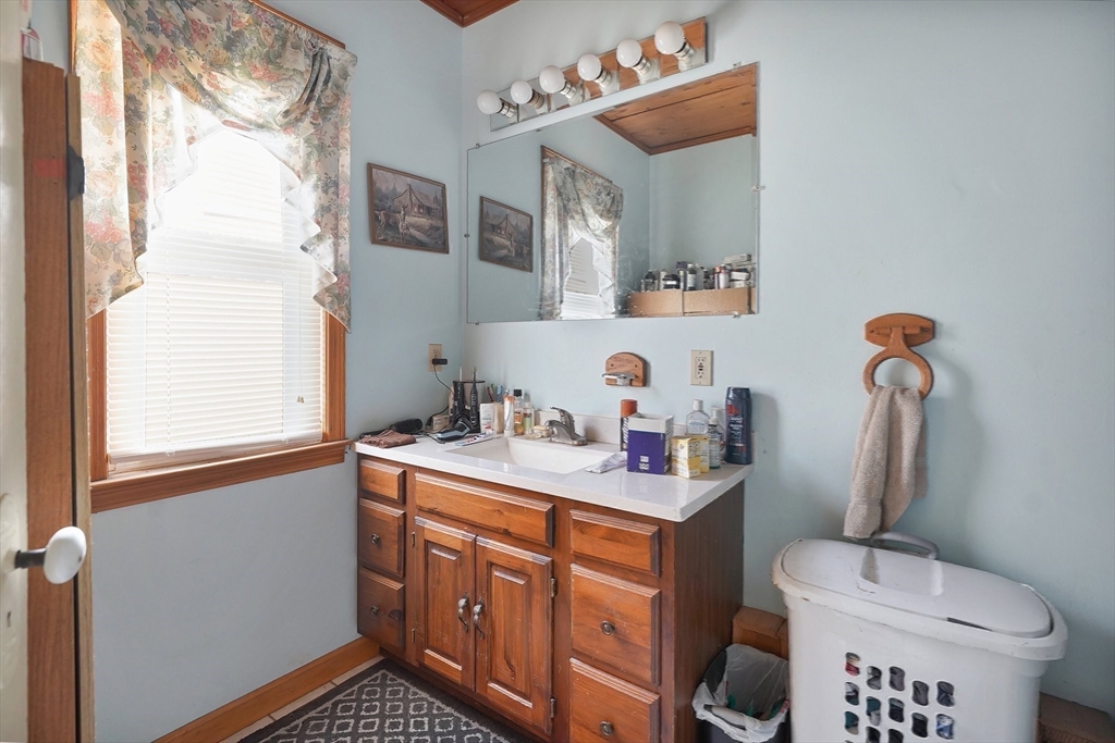 86-88 Chestnut Street Springfield, MA 01151 - Photo 25 of 40 a bathroom with a sink toilet and mirror