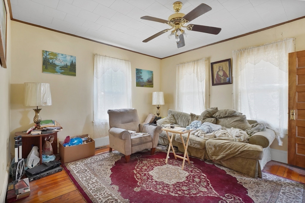 86-88 Chestnut Street Springfield, MA 01151 - Photo 28 of 40 a living room with furniture or couch and a table