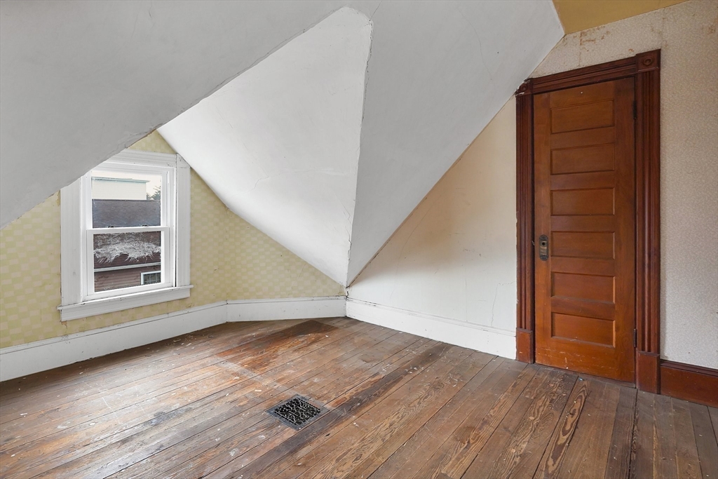 86-88 Chestnut Street Springfield, MA 01151 - Photo 31 of 40 a view of an entryway with wooden floor and door