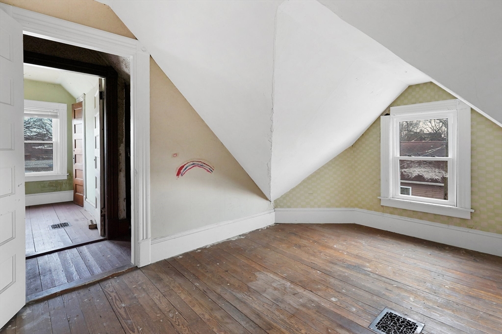 86-88 Chestnut Street Springfield, MA 01151 - Photo 32 of 40 wooden floor in an empty room with a window