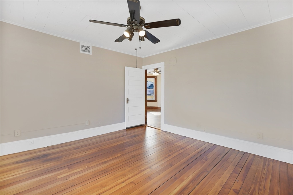 86-88 Chestnut Street Springfield, MA 01151 - Photo 8 of 40 a view of an empty room with wooden floor