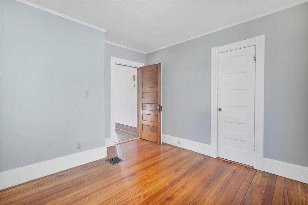 86-88 Chestnut Street Springfield, MA 01151 - Photo 10 of 40 a view of an empty room with wooden floor