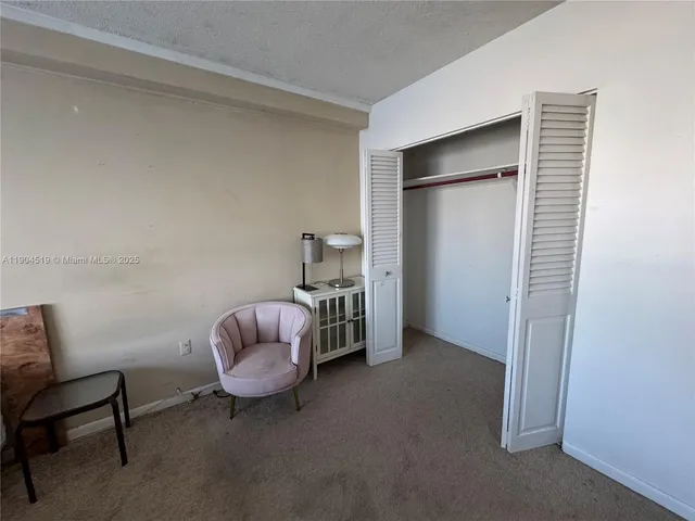 a living room with furniture and a chair