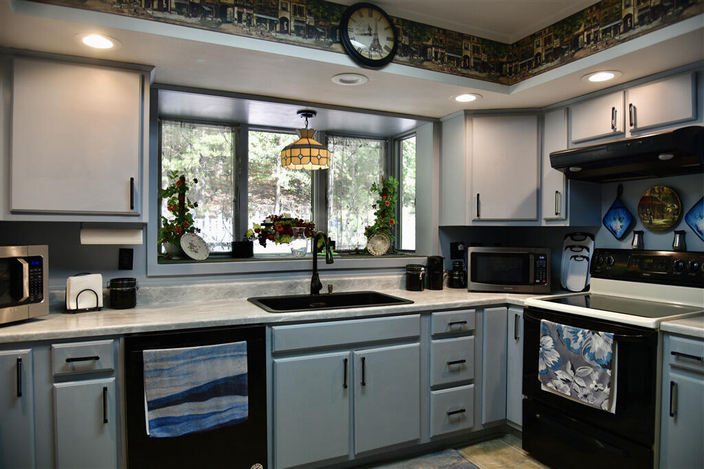 102 Keswick Farm Road Troutville, VA 24175 - Photo 13 of 29 a kitchen with a sink cabinets and window