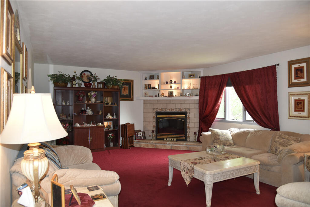 102 Keswick Farm Road Troutville, VA 24175 - Photo 9 of 29 a living room with furniture and a fireplace