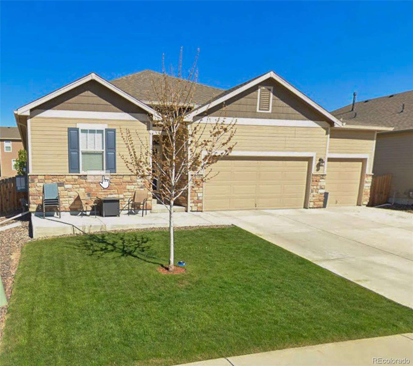 910 Pierson Court Windsor, CO 80550 - Photo 2 of 42 a front view of a house with a yard