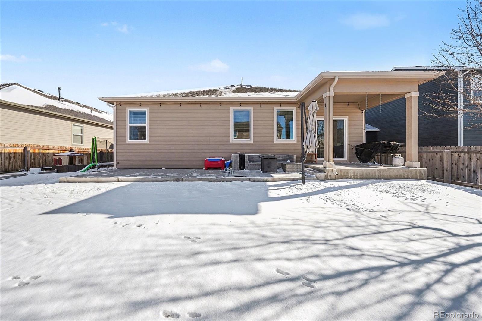 910 Pierson Court Windsor, CO 80550 - Photo 24 of 42 a view of a house with snow on the road
