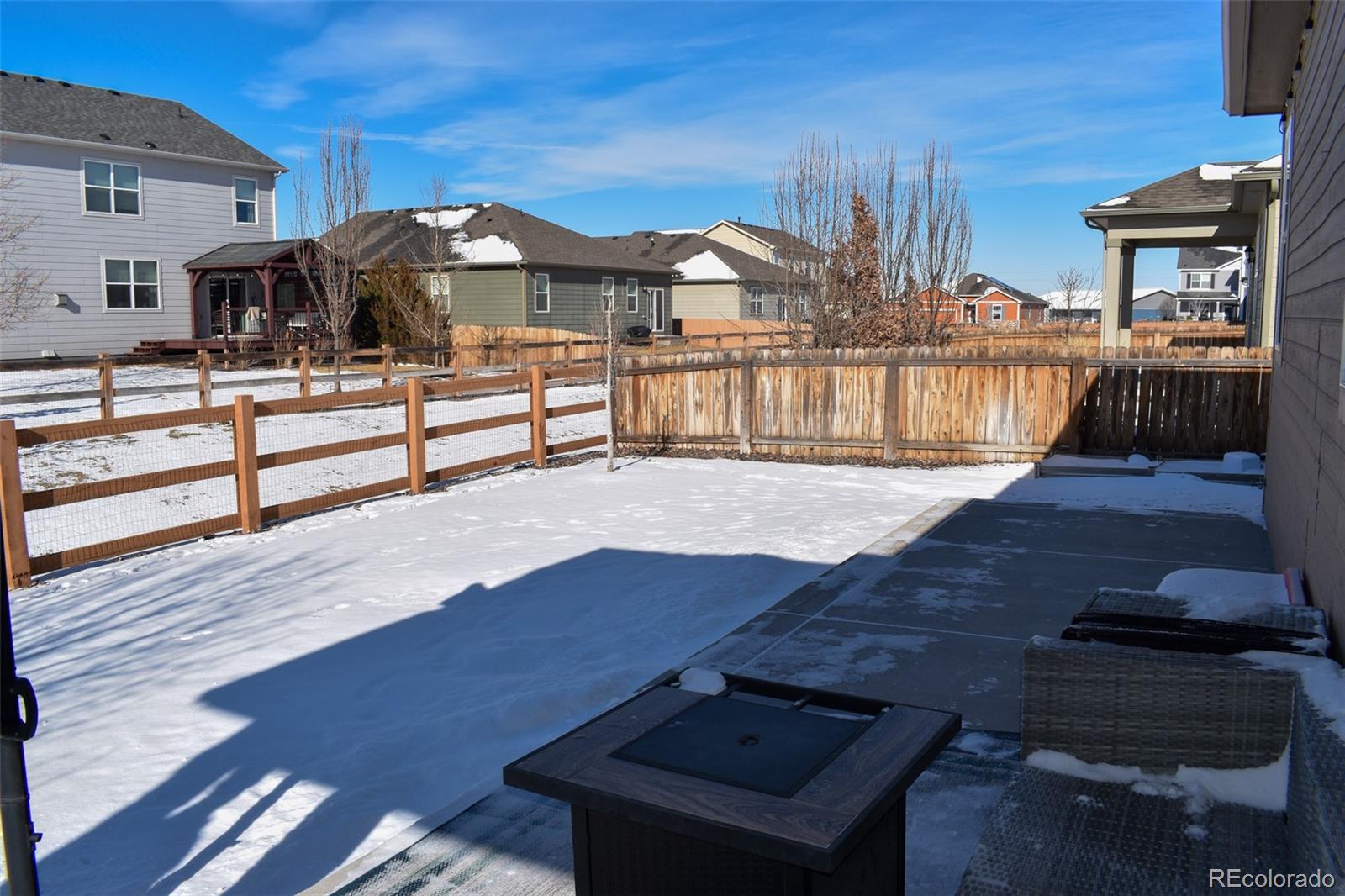 910 Pierson Court Windsor, CO 80550 - Photo 28 of 42 a view of a terrace with wooden benches