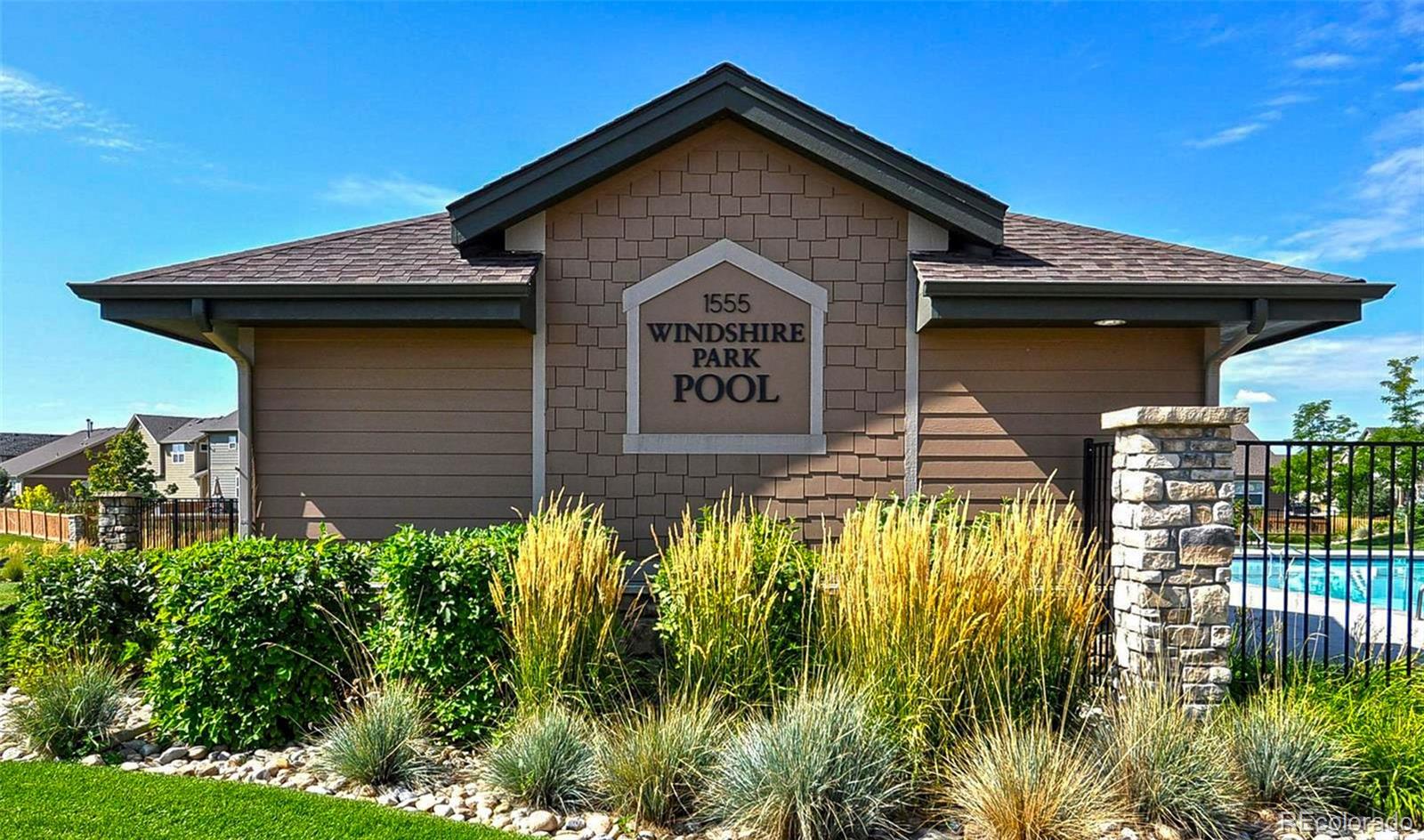 910 Pierson Court Windsor, CO 80550 - Photo 39 of 42 a view of a house with a small yard and plants