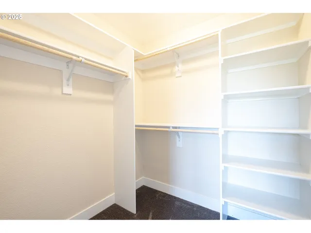 a view of an empty walk in closet