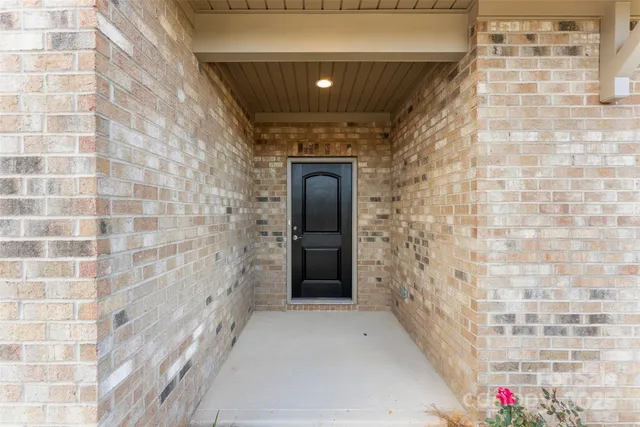 a front view of a house with a garage