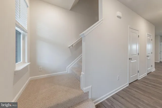 a view of entryway with wooden floor